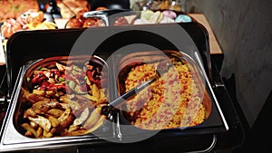 Buffet heated trays with sausages, in hotel luxury restaurant. All inclusive. Buffet food. Hotel serves buffet for breakfast.