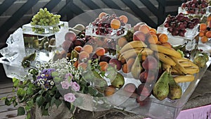 Buffet line assorted Fruit platter of strawberries Raspberry Grapes Blueberries Peaches Apricot Banana Cherry Cherries