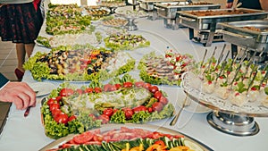 Business catering people take buffet food during company event