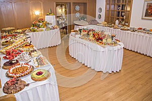 Buffet with sweets. fruits and other sweets on dessert table. Rows of tasty looking desserts in beautiful arrangements. Sweets on