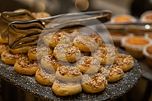 Buffet table with various cookies and biscuits, tarts and cakes