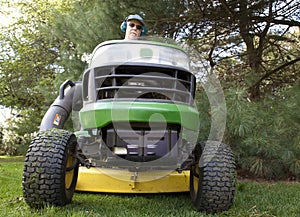 Bug's-Eye View of Man on Riding Lawnmower