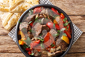 Buglama Traditional hot ragout with meat and vegetables closeup in the Bowl. Horizontal top view