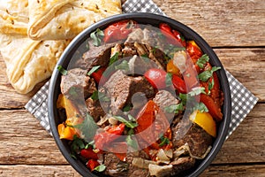 Buglama Traditional hot ragout with meat and vegetables closeup in the Bowl. Horizontal top view photo