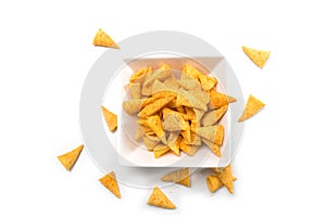 bugles salted appetizers in a white bowl on top view on white background