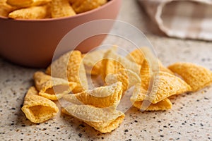 Bugles snack. Cone corn chips on kitchen table