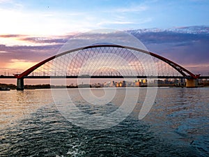 Bugrinsky Bridge over River Ob in big city Novosibirsk, Russia, sunrise or sunset, evening view