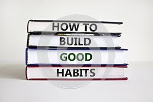 Build good habits symbol. Books with words `How to build good habits`. Beautiful white background, copy space. Business,