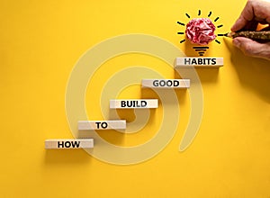 Build good habits symbol. Wooden blocks on beautiful yellowbackground, copy space. Words `How to build good habits`. Businessman