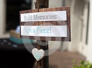 Build Memories and Sign a Piece sign
