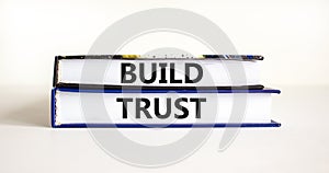 Build trust symbol. Concept words Build trust on books on a beautiful white table white background. Business and build trust