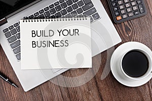 Build your business text on note pad