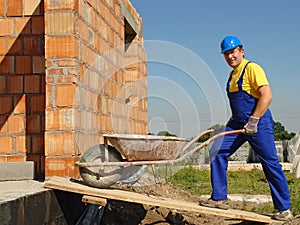 Builder with barrow photo