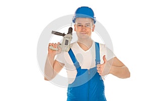 Builder in blue uniform with drill in hands