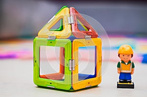 Builder and building industry concept. Toy house.