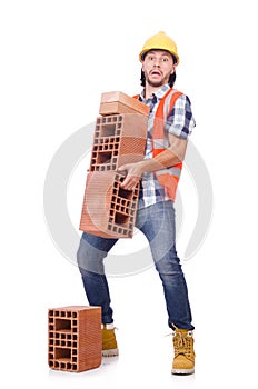 Builder with clay bricks isolated