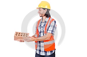 Builder with clay bricks isolated
