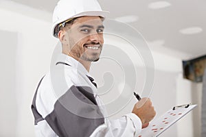 builder in with clipboard indoors photo