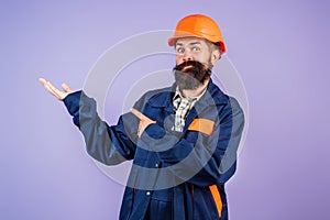 Builder concept. Builder foreman. Caucasian man worker in helmet. Worker in helmet isolated on studio background