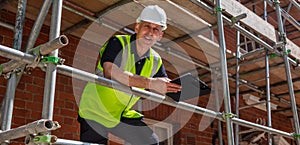 Builder Construction Worker Contractor on Building Site With Clipboard Panorama