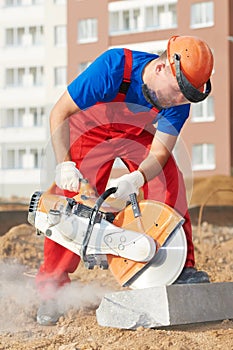 Builder at cutting curb work