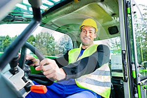 Builder driving construction machinery