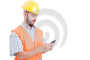 Builder or engineer texting or sending sms