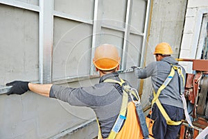 Builder at facade construction work