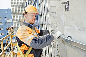 Builder at facade construction work