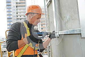 Builder at facade construction work