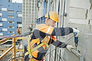 Builder at facade construction work