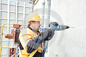 Builder at facade construction work