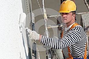 Builder facade painter at work