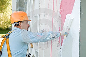 Builder facade painter at work