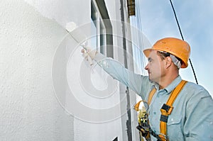 Builder facade painter at work