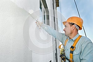 Builder facade painter at work
