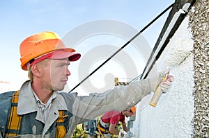 Builder facade painter at work