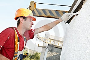 Builder facade painter at work