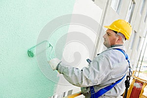 Builder facade painter at work