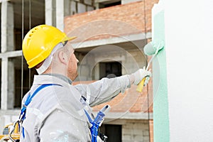 Builder facade painter at work