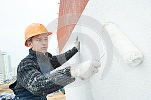Builder facade painter at work