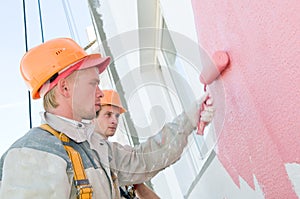Builder facade painters at work