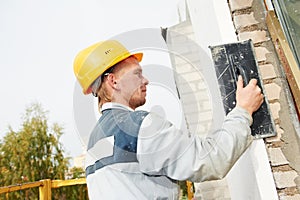 Builder facade plasterer worker