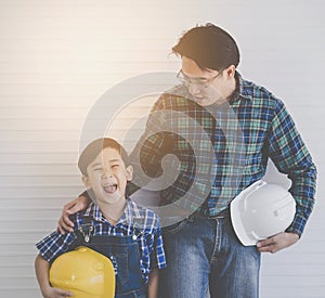 Builder father Stading next to his son for family connection concept in vintage tone