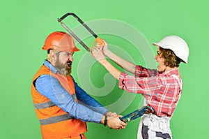 Builder fighting. real estate deal. couple of architect wear hardhat. new house construction concept. Portrait of family