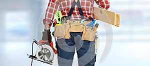 Builder handyman with electric saw.