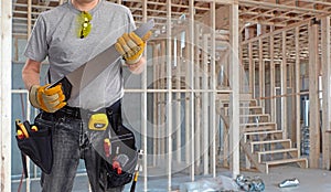 Builder handyman with hand saw.