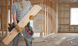 Builder handyman with wooden planks.