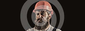 Builder in hardhat. Builder with helmet. Worker builder in helmet at building. Portrait of Builder with helmet and