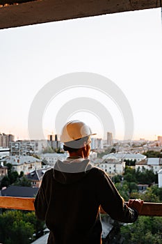 Hard hat builder inside building under construction